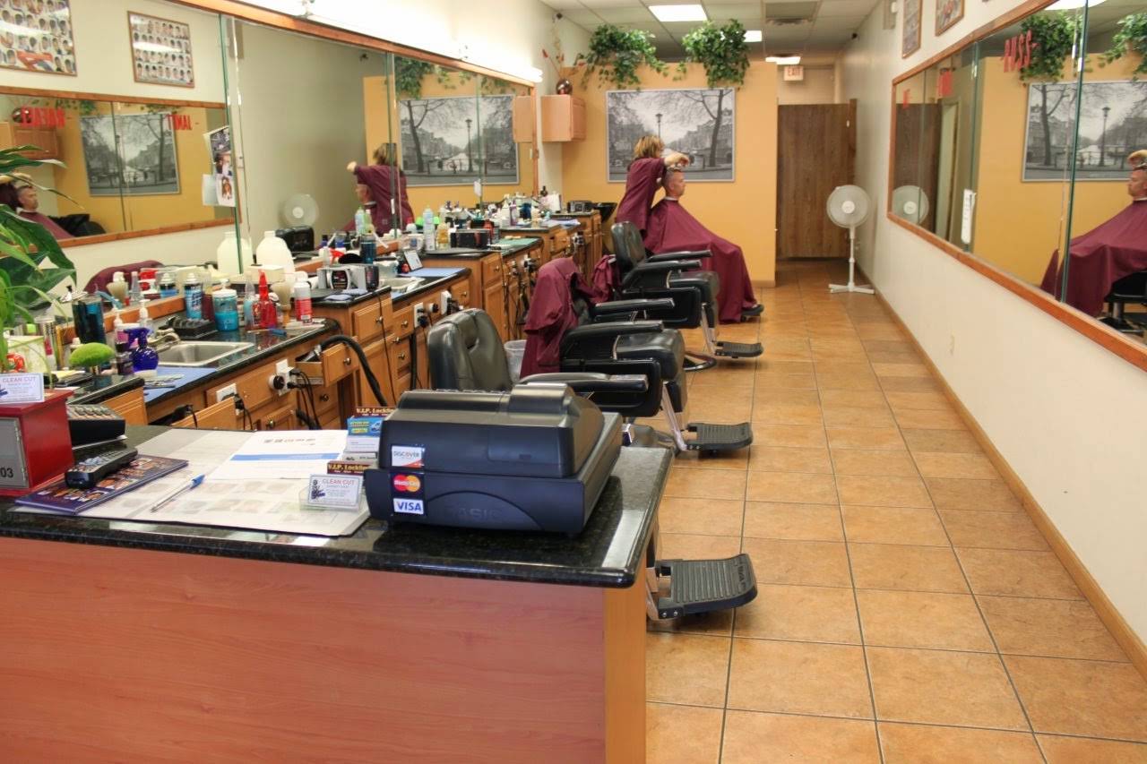 Clean Cut's Bell Road shop with long wall mirrors, barber stations and a front waiting area
